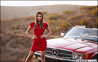 Gianna Dior in red dress posing outdoor