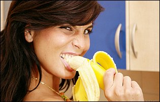 Young Jana Miartusova posing in the kitchen